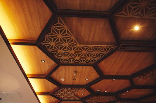 a wooden ceiling with a geometric design on it at Hotel Indigo Hakone Gora by IHG in Hakone