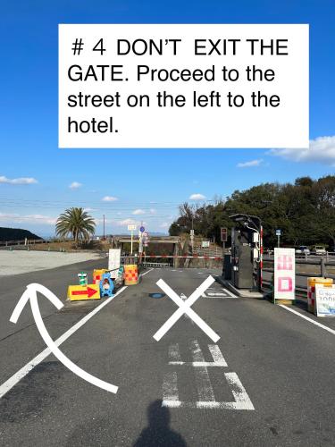a sign that says dont exit the gate at Hotel Bokaiso in Takamatsu