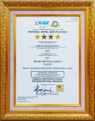 a diploma in a gold frame with a certificate at Solia Legian Bali in Legian