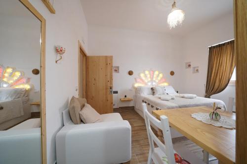 Postel nebo postele na pokoji v ubytování B&B Le Stanze di Nonna Cecè
