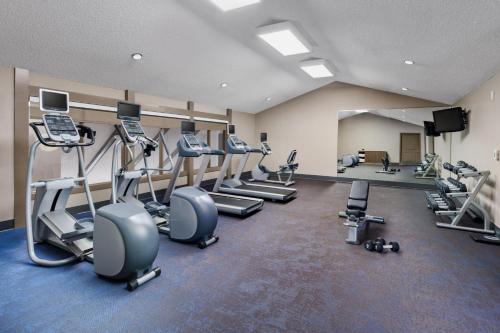 a gym with several treadmills and cardio machines at Residence Inn Fremont Silicon Valley in Fremont