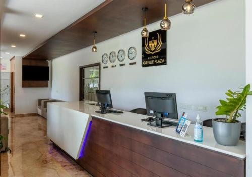 a bar in a restaurant with a counter top at Airport Avenue Plaza in Nedumbassery