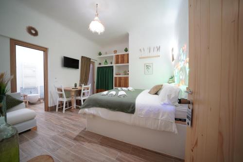 Ένα ή περισσότερα κρεβάτια σε δωμάτιο στο B&B Le Stanze di Nonna Cecè