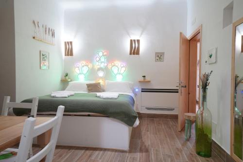 Postel nebo postele na pokoji v ubytování B&B Le Stanze di Nonna Cecè