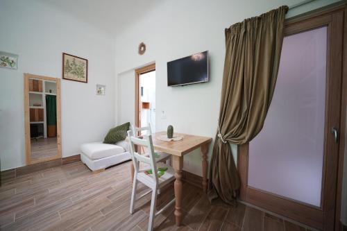 TV a/nebo společenská místnost v ubytování B&B Le Stanze di Nonna Cecè
