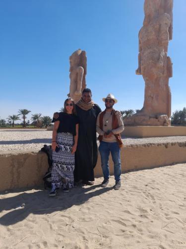 a group of people standing in front of a wall at Valley Of The Kings House in Luxor