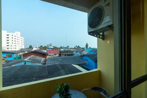 a view of a city from a window at Chomsin Hua Hin ชมสินธุ์ หัวหิน in Hua Hin