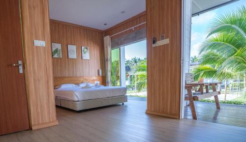 Postel nebo postele na pokoji v ubytování 听海·度假庄园