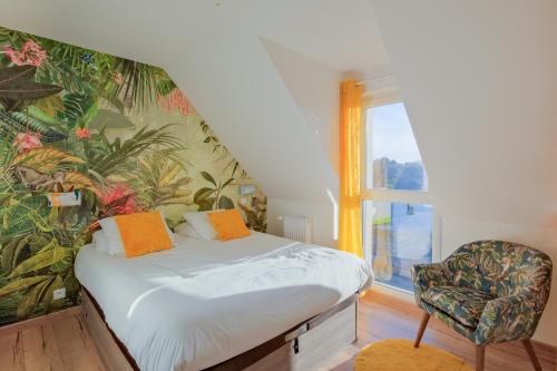 En eller flere senge i et værelse på La Brise Tropicale - Belle maison avec jardin