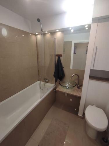 a bathroom with a shower and a toilet and a sink at Alicante Apartament - 48m² ✓ in Rybnik