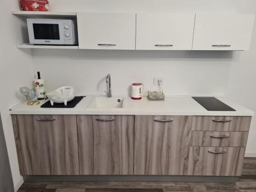 Kuchyň nebo kuchyňský kout v ubytování Residence Le Aromatiche
