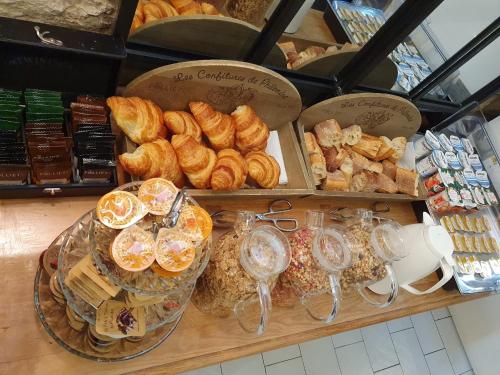 a bakery with a variety of breads and pastries at Port Royal Hotel in Paris