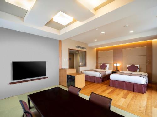 TV a/nebo společenská místnost v ubytování Irago Ocean Resort