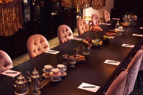 a long table in a room with chairs around it at MJ's in Malmö