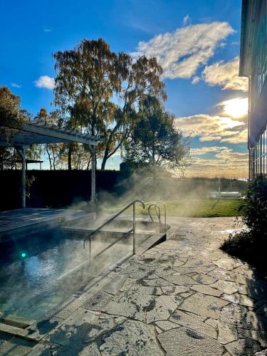 a pool of water with steam coming out of it at Ystad Saltsjöbad in Ystad