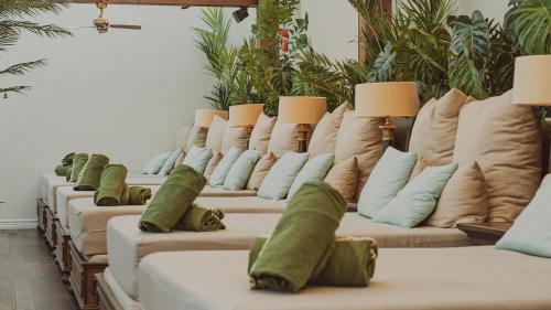 a row of couches with pillows on them at Falkenberg Strandbad in Falkenberg