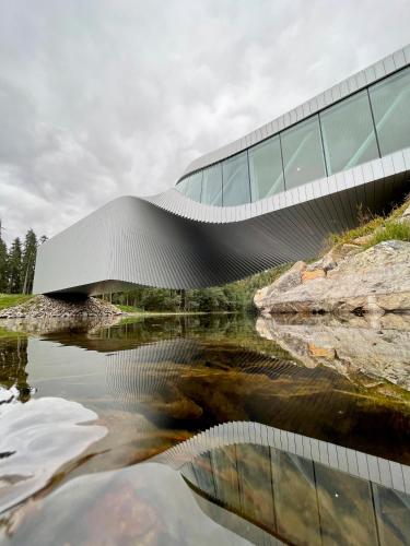 a building with a river in front of it at Sundvolden Hotel in Sundvollen