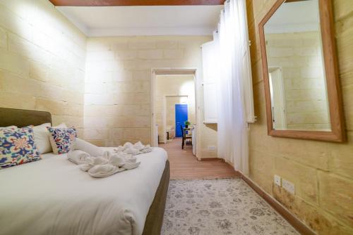 Postel nebo postele na pokoji v ubytování Valletta Collection - Felix Apartments