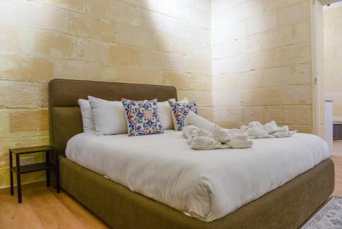 Postel nebo postele na pokoji v ubytování Valletta Collection - Felix Apartments