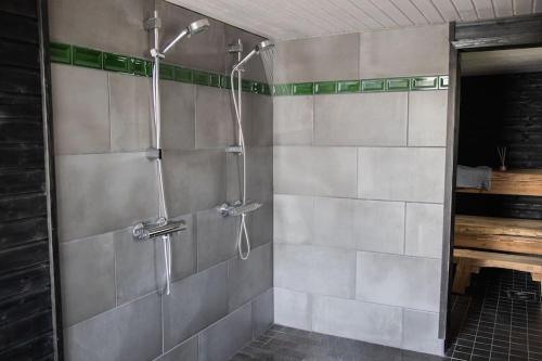a shower stall in a bathroom with at Ihana järvenranta mökki. Cottage by the lake. in Kurjalanranta