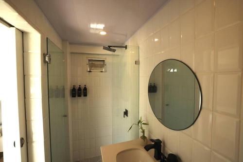 a bathroom with a sink and a mirror at The Perfect Suite B in Playa Hermosa