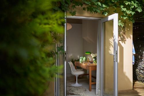 a dining room with a table and a dining room at Spanish Farm Boutique Hotel & Villas in Somerset West