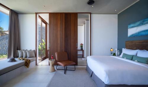 Ein Bett oder Betten in einem Zimmer der Unterkunft Selong Selo Resort and Villas