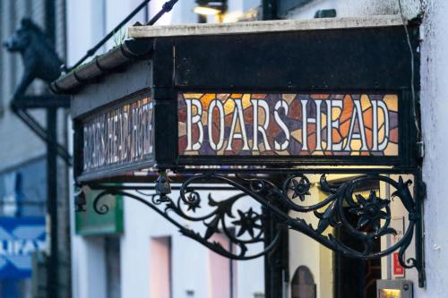 a sign on the side of a building at Boars Head Hotel in Carmarthen