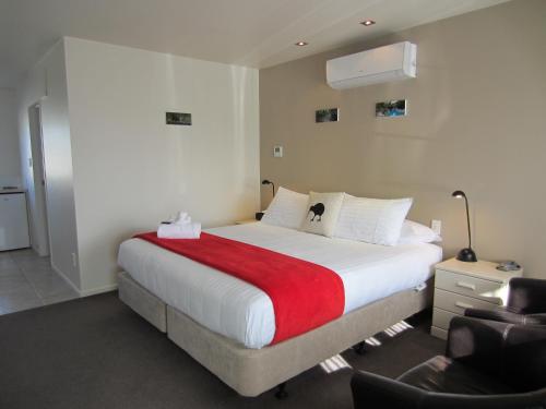 Postel nebo postele na pokoji v ubytování Alpine Rose Motel