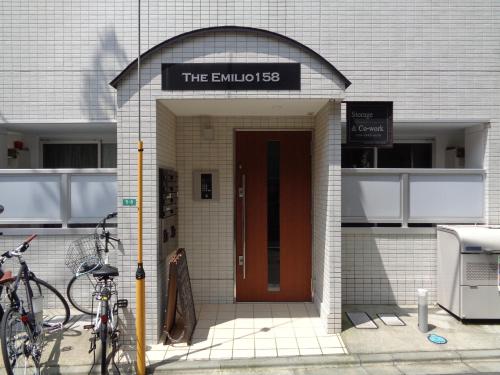 a building with a door with a sign on it at EMILIO158 - Quiet residential area near Shinjuku Free Wi-Fi in Tokyo