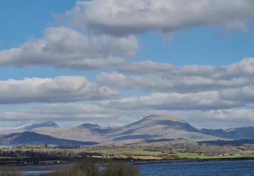 a view of mountains and a body of water at Snowdonia View@puffin Lodges in Chwilog