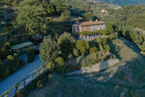an aerial view of a house on a hill at Villa Marlia in Lucca