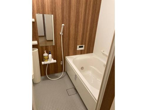 a bathroom with a bath tub and a sink at base sanablend - Vacation STAY 39607v in Kyotango