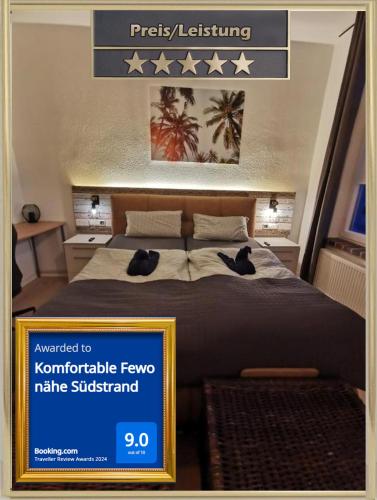 Cartel de un dormitorio con 2 gatos en una cama en Komfortable Fewo nähe Südstrand, en Wilhelmshaven