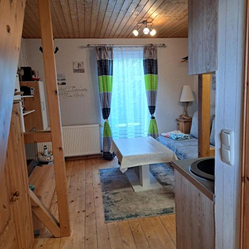 a small room with a bed and a window at Fewo Seepferdchen in Zempin