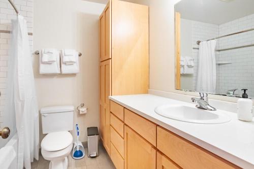 a bathroom with a sink and a toilet at Old Town 1br near dining bars tech hubs PDX-15 in Portland