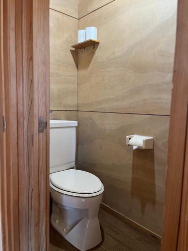 a bathroom with a toilet and a roll of toilet paper at Jomine Koen Campjo - Vacation STAY 85267v in Minano