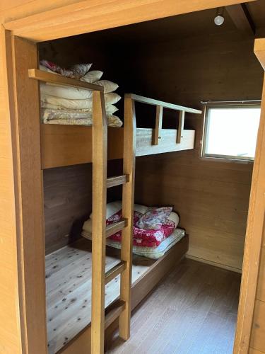 a room with bunk beds in a cabin at Jomine Koen Campjo - Vacation STAY 85265v in Minano