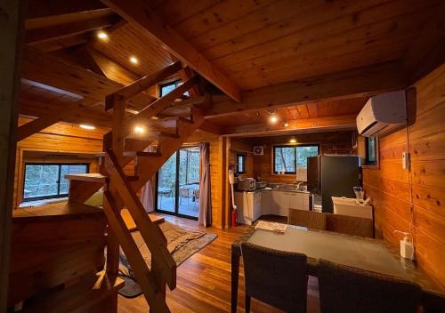 a kitchen and living room in a log cabin at NAKADAKI ART VILLAGE - Vacation STAY 23991v in Shiigi
