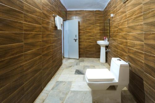 a bathroom with a toilet and a sink at Star Desert Camp Jaisalmer in Jaisalmer