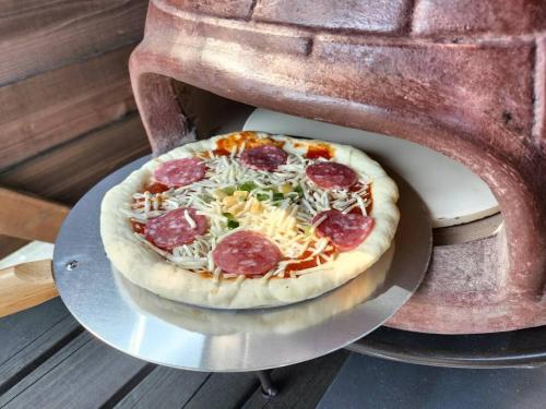 a pizza sitting on top of a pizza scale at GRAN BLUE - Vacation STAY 46768v in Hongō