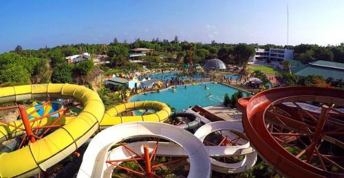 a water park with a bunch of water slides at Roma Stays Sunset Holiday Apartments 3Bedrooms & swimming pool in Mombasa