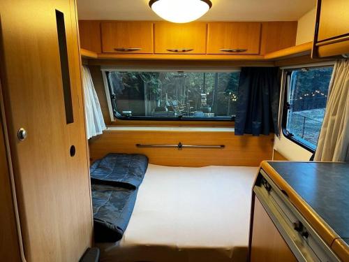 a small room with a bed in an rv at Re Come Across Doglamping - Vacation STAY 42085v 