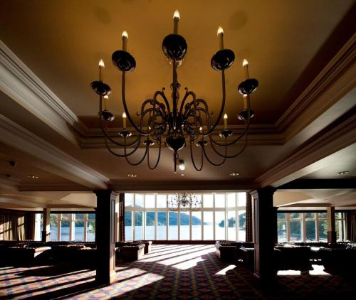 a chandelier hanging from the ceiling in a room at Ardgartan Hotel in Arrochar