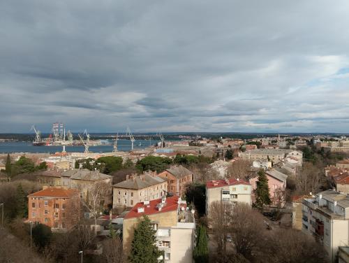 a view of a city with boats in the water at Rise and shine! in Pula