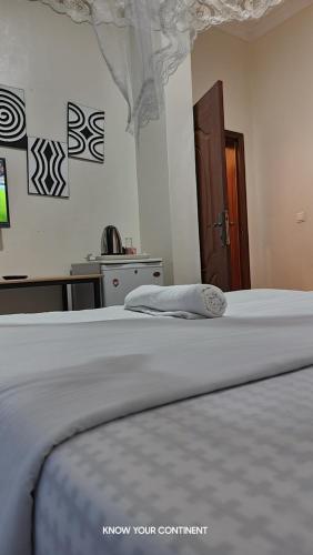 a close up of a bed in a bedroom at Puma Aparthotel - Nyarutarama in Kigali