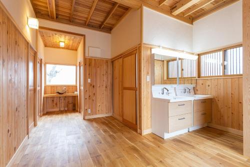 a bathroom with a sink and a mirror at Private resort Hibiki no Yado & Mori - Vacation STAY 85306v in Sato-moriya