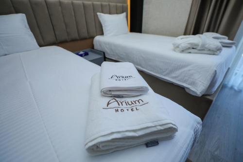 Кровать или кровати в номере Arium Hotel Baku