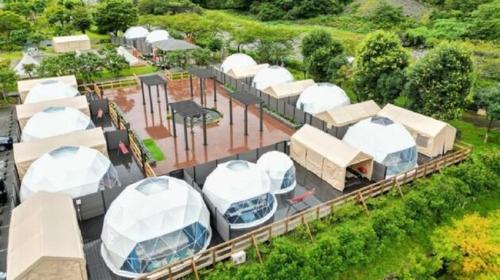 an aerial view of a facility with white domes at SPRINGS VILLAGE Ashigara-Tanzawa Hot Spring Resort & Glamping - Vacation STAY 42311v in Oyama