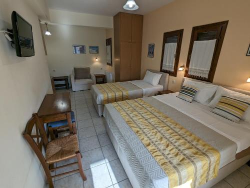 A bed or beds in a room at Pagaseon Rooms and Apartments